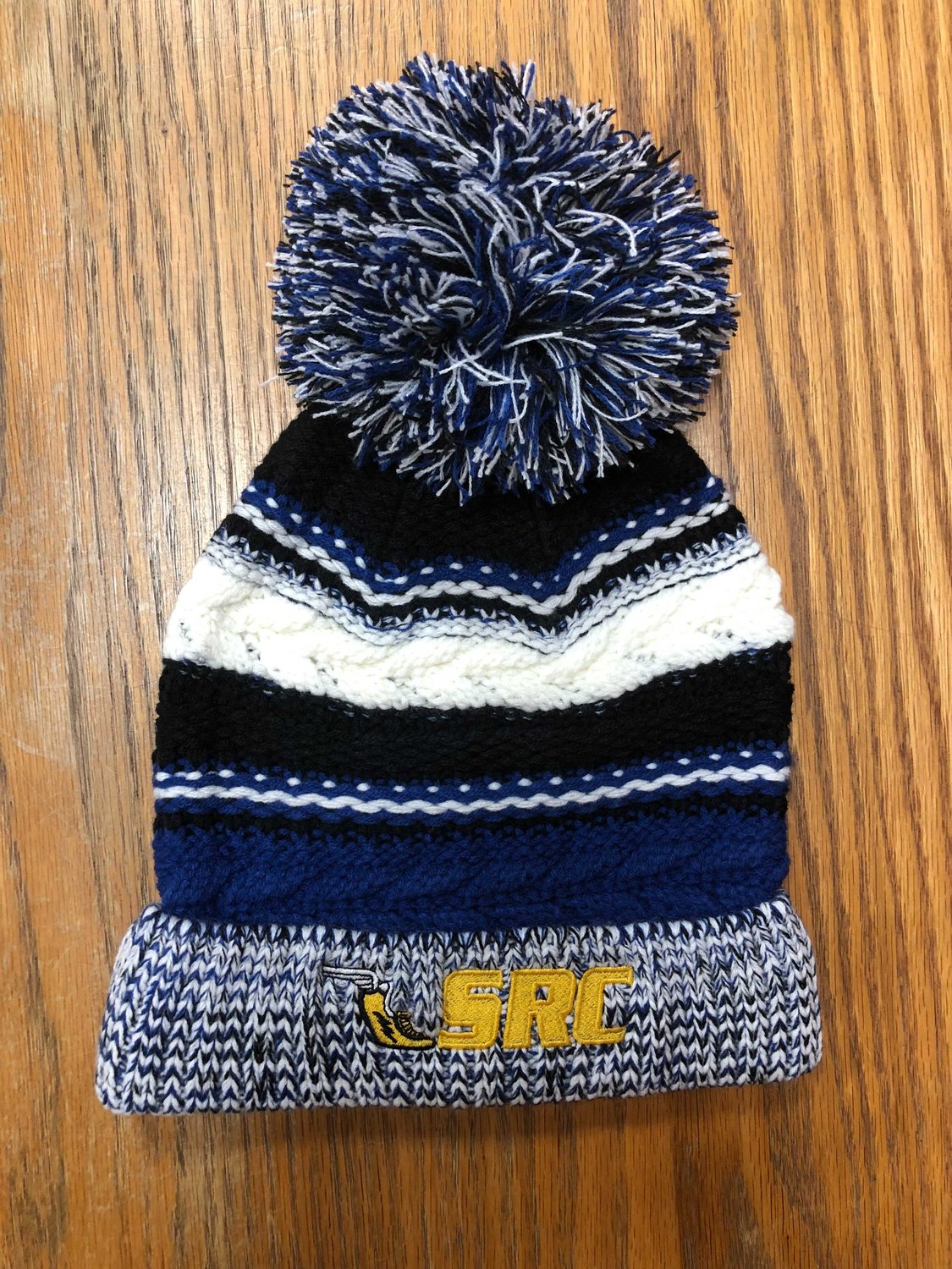 FOR HER COLD WINTER NIGHTS IN THE SWISS ALPS
Sayville Running Company
889 Montauk Hwy, Bayport
$25, SRC pom-pom Hat
